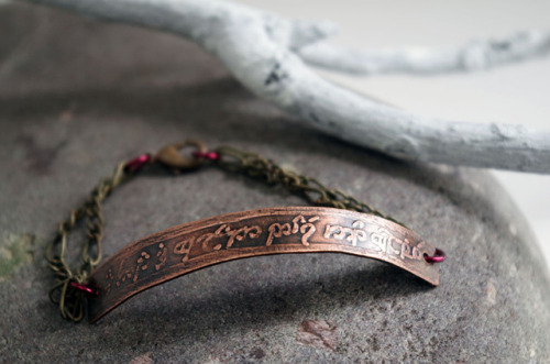 I’m doing a giveaway of this Elvish bracelet over at my (non-Tumblr) blog!The front of the bracelet 