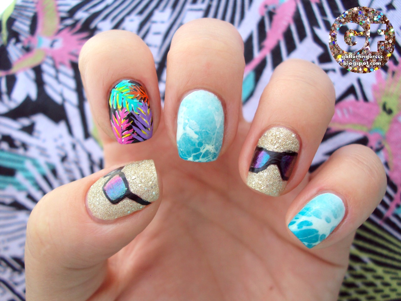 Beachy nails with sand, color shifting sunglasses,...