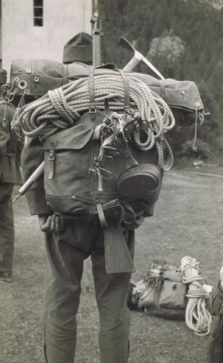 hangaround:  oldfellingaxe:  Mountaineering time.  German boy scouts still use these black tent tarps today. Camping in winter, heavy rain and strong wind. No fuckin problem. 