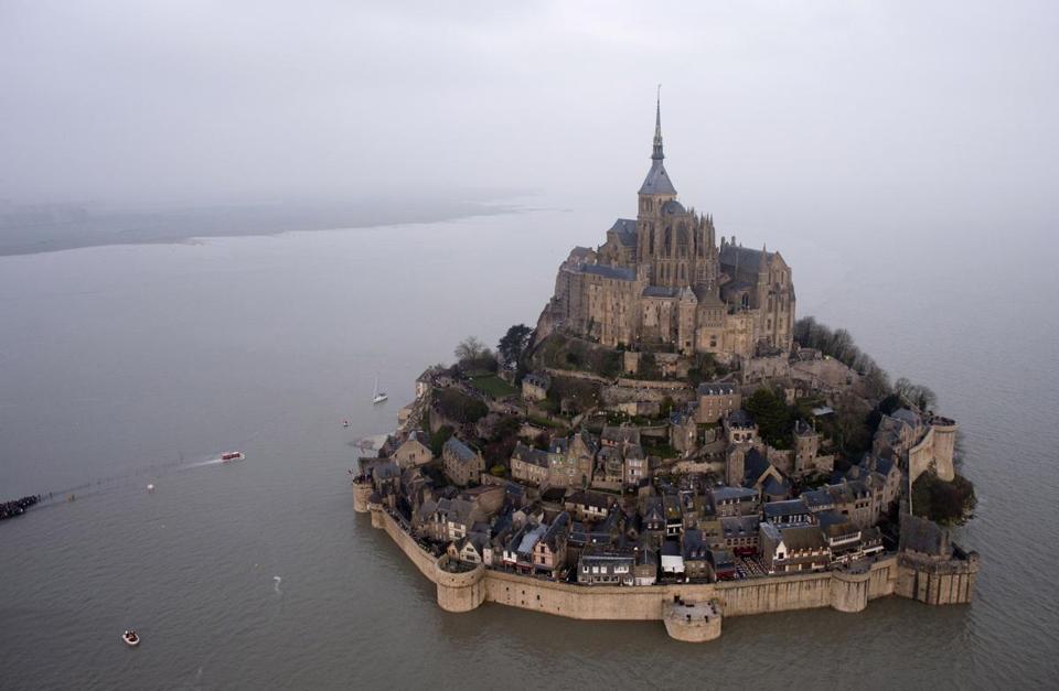 prints:  Rare supertide turns ancient Mont Saint-Michel into island 