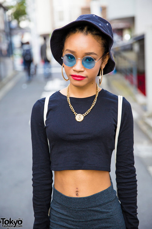 Japanese rapper Lil Honey Princess on the street in Harajuku wearing a crop top, mini skirt, studded