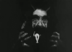 sixpenceee:  A scene of satan eating a human from L’inferno (1911) a 1911 old Italian