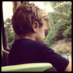 Random kid on the train. He&rsquo;s having fun looking out the window. I miss that sense of innocence and wonder. #oldsoul