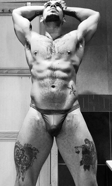 dominicanblackboy:  A sexy moment in black and white wit gorgeous tatted stud Wally Couto!😍