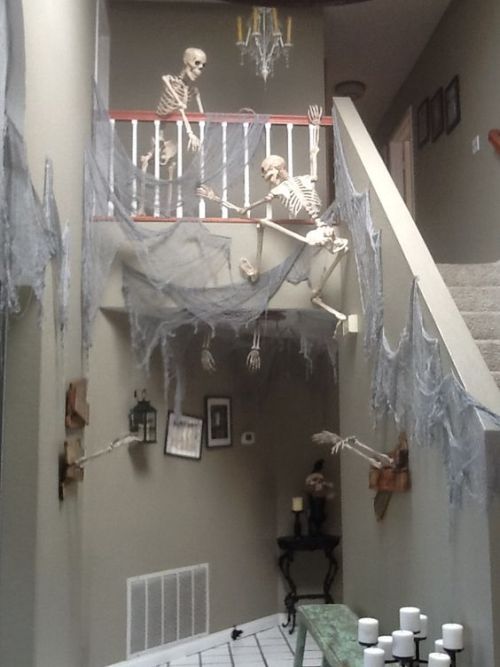 sixpenceee:  Climbing skeletons make one creepy halloween decoration!