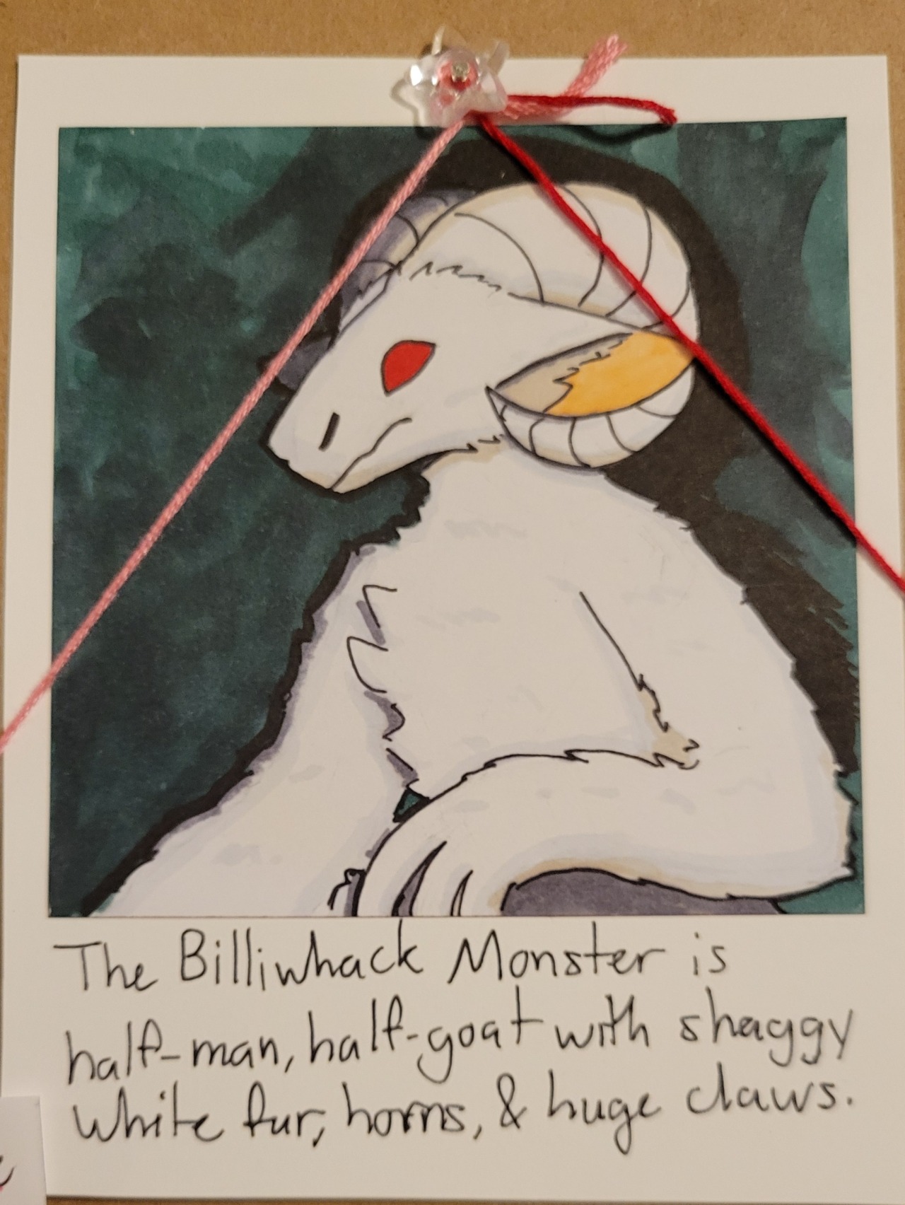 The Billiwhack Monster, a white, furry creature with ram’s horns, red eyes, and claws.