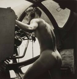 button-up-sherman:gregferrell: maleinstructor:  In the heat of battle, photographer Horace Bristol captured one of the most unique and erotic photos of WWII. Bristol photographed a young crewman of a US Navy “Dumbo” PBY rescue mission, manning his