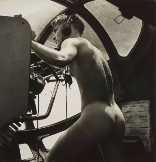 orbisonblue:
kozacy:


In the heat of battle, photographer Horace Bristol captured one of the most unique and erotic photos of WWII.
Bristol photographed a young crewman of a US Navy “Dumbo” PBY rescue mission, manning his gun after having stripped naked and jumped into the water of Rabaul Harbor to rescue a badly burned Marine pilot. The Marine was shot down while bombing the Japanese-held fortress of Rabaul.
 “…we got a call to pick up an airman who was down in the Bay. The Japanese were shooting at him from the island, and when they saw us they started shooting at us. The man who was shot down was temporarily blinded, so one of our crew stripped off his clothes and jumped in to bring him aboard. He couldn’t have swum very well wearing his boots and clothes. As soon as we could, we took off. We weren’t waiting around for anybody to put on formal clothes. We were being shot at and wanted to get the hell out of there. The naked man got back into his position at his gun in the blister of the plane.”


“And well, there was his butt, and I had a camera. I mean I AM a historian.”


That is the BEST EVER quote about the nature of historians I’ve ever seen 