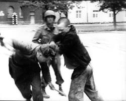 starving-cannibal:  death—to—pigs:  mfjr: A freed Jewish prisoner expresses his rage and beats down a German guard at the liberated Dachau Concentration Camp. An American soldier looks on and does not interfere. Germany, 1945  