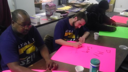 Columbus janitors make signs for today’s rally! As they prepare to make a stand for living wag