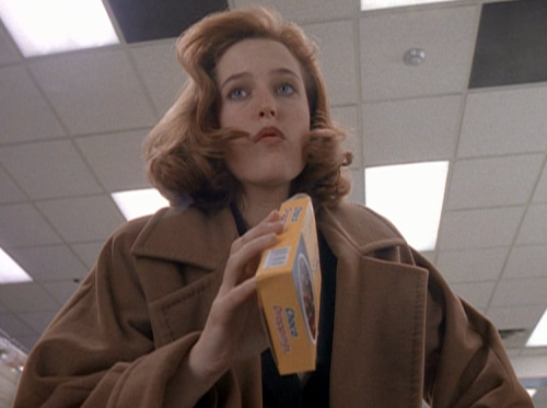 ursulastrausss:Scully looking good while eating choco droppings.