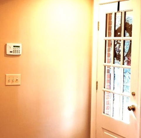 Mudroom - Traditional EntryMid-sized Elegant Medium Tone Wood Floor And Brown Floor Entryway Photo With