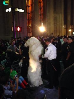 stunningpicture:  NYPD just arrested a polar bear at Flood Wall Street  That Captain Planet in the corner needs to get off his ass, Gaia didn&rsquo;t die for this.