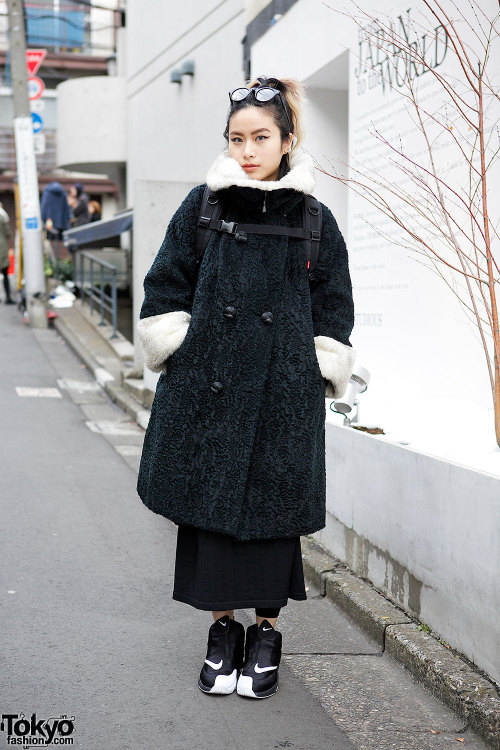 Fashion buyer on the street in Harajuku wearing a vintage coat with Nike sneakers, Supreme, Chrome H