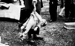 bag-of-dirt:  A Chinese toddler, killed during a Japanese aerial attack on civilians at the Shanghai South Railway Station during the Battle of Shanghai, is taken away from the scene. Some 1,800 people, mostly women and children, had been waiting at