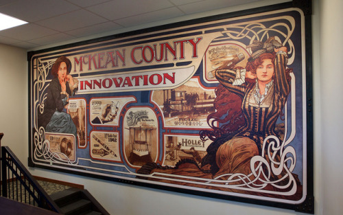 Large art-nouveau-inspired interpretive mural featuring important innovations from McKean County Pen