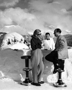 life: From a 1947 story on St. Moritz, Switzerland - “Midday cocktails at St. Moritz are served on the private ice rink of the Palace Hotel at a bar made of snow.” (Alfred Eisenstaedt—The LIFE Picture Collection/Getty Images) #FashionFriday #1940s