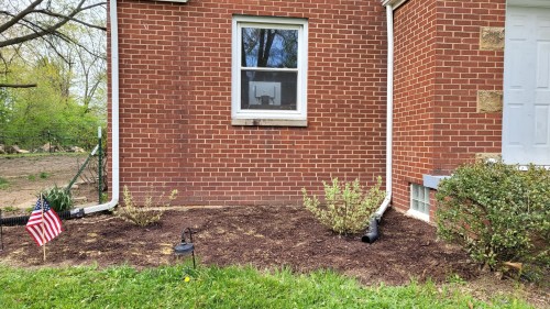 katiiie-lynn:It’s not the prettiest presentation because it still needs work, but spent all day outside weeding the flower beds and finally laying down some mulch. Planted some lilacs outside our reading room windows, planted grass seed by our A/C