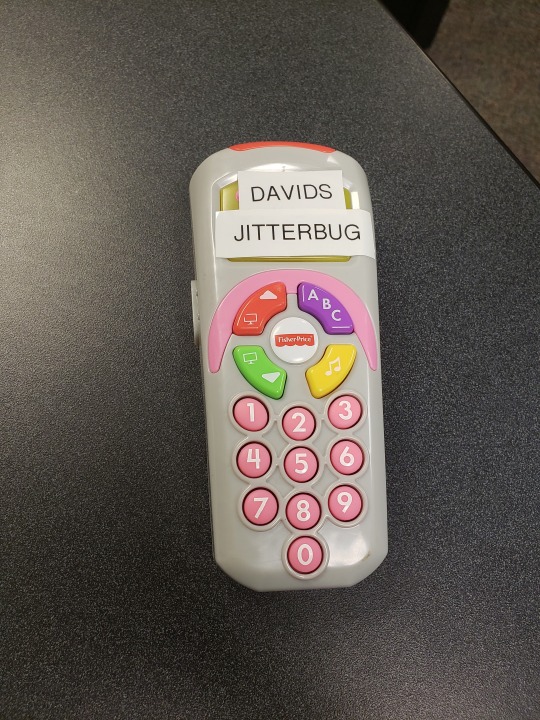 beka-tiddalik: queenieeegoldstein:  queenieeegoldstein:  apparently my boss who is a professor at my school doesn’t have a cell phone and his coworkers were upset by this so they bought him a childs toy phone and labeled it “David’s jitterbug”