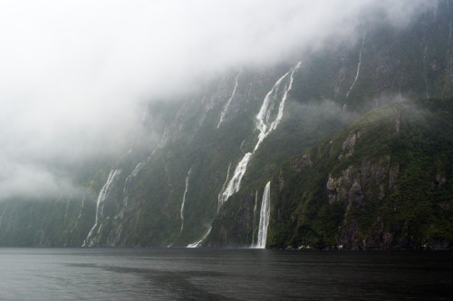 Waterfalls and clouds at Milford Sound.Milford Sound, Fiordland, South Island, New Zealand