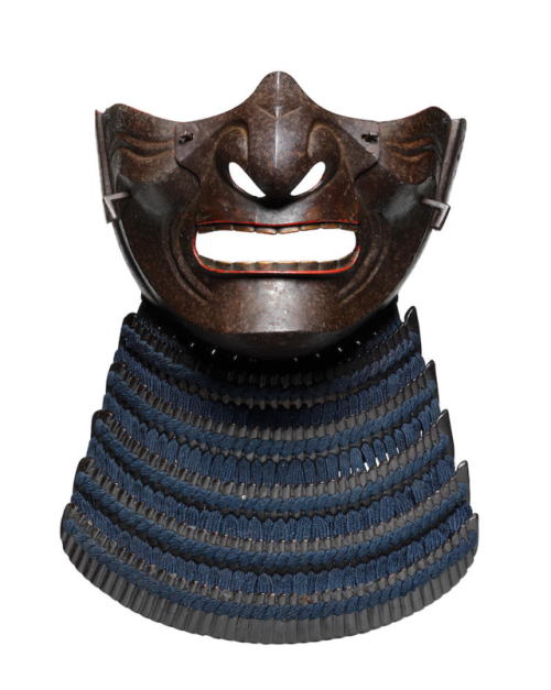 An iron menpo (face mask)Edo period (1615-1868), 18th centuryThe russet-iron mask bearing a fierce e