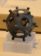 A Roman dodecahedron is a small hollow object made of bronze or stone, with a dodecahedral shape: tw