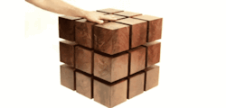 katieplierr:  utilitarianthings:  The Float Table is a matrix of “magnetized” wooden cubes that levitate with respect to one another. The repelling cubes are held in equilibrium by a system of tensile steel cables. It’s classical physics applied