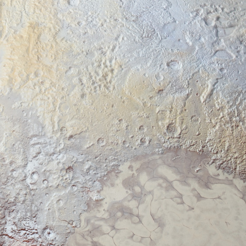 skunkbear:This is one slice of an incredible high resolution, enhanced color image of Pluto, recently released by NASA. 