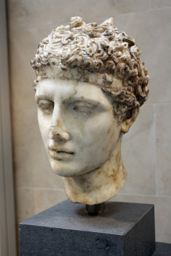 caesaringaul:  Roman Marble Head of an Athlete, Based Upon a Greek Bronze Statue, Antonine, ca. 138-192 C.E.   This head of a youth wearing a fillet must have belonged to the statue of a victorious athlete. He probably rested one arm lightly on his