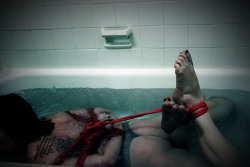 theropegeek:Hogtied in the bathtub while