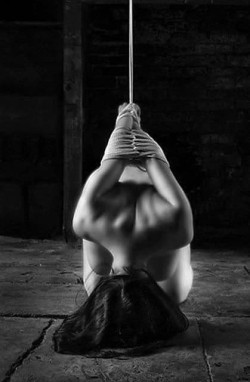 A woman. Tied up. 