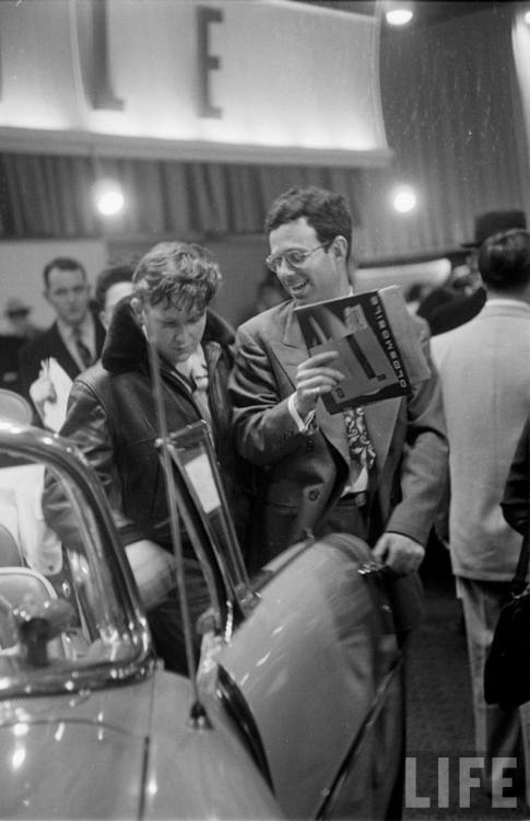 Checking out the new cars at the auto show(Ralph Morse. 1954)