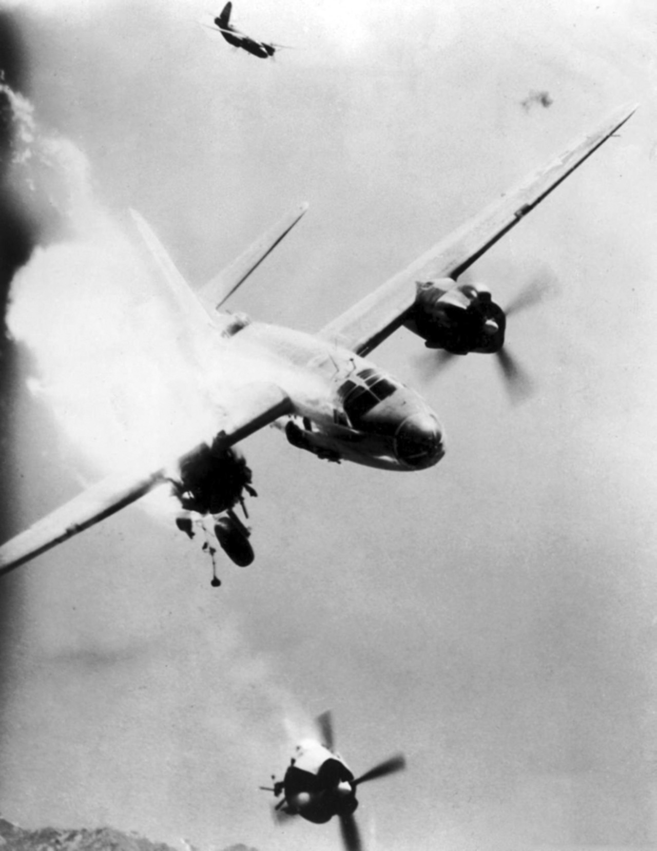 historicaltimes:  A B-26 bomber which later crashed killing 6, loses an engine after