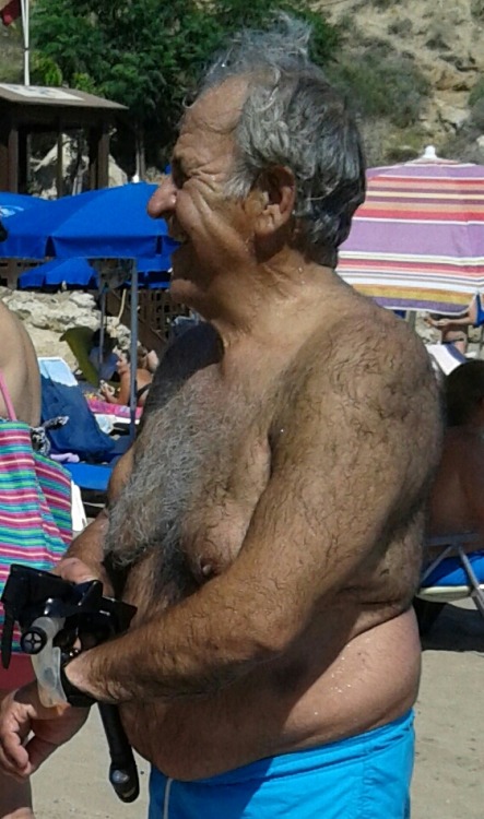 Definitely the sexiest hairy grandpa on the beach today. I love the hairy chest and belly.