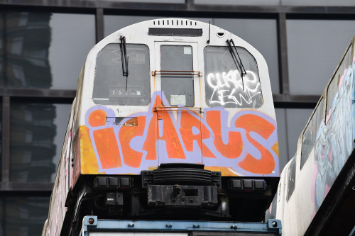 Icarus, the tube train, flies from a roof top above Shoreditch