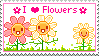 a white stamp with yellow and pink flowers and pink text that reads 'I heart flowers'