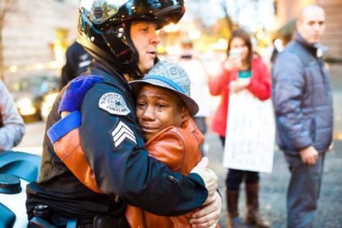 caitlintheawesome:White cop, black boy hug at Portland rally for Ferguson: story behind striking pho