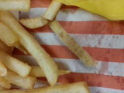 weallheartonedirection:  I reached for this fry like three times.. It’s printed on the paper. Thanks Whataburger  Love me some Whataburger!