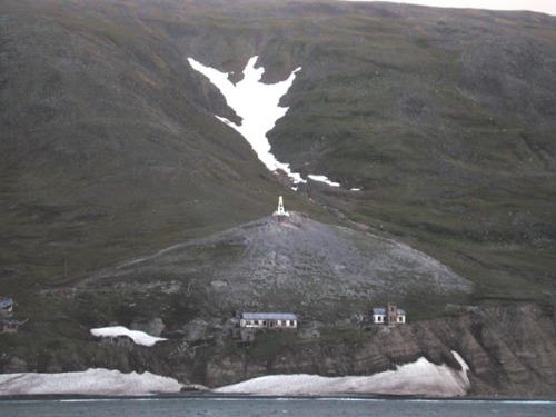 The abandoned village of Naukan in Mechigmanskiy Bay, Cape Dezhnev(Siberia, Russia).The abandoned vi