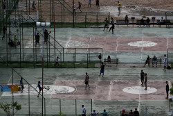 timelightbox:  Photograph by Mario Tama—Getty Images Nov. 20, 2013. People play football and basketball in Manaus, Brazil.  TIME presents the best pictures of the week. 