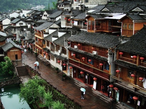 odditiesoflife:  The Ancient Town of Fenghuang, China The town of Fenghuang is located in the Hunan province in China along the banks of the Tuo Jiang River. The town is exceptionally well-preserved and relatively untouched by modern urbanization. The