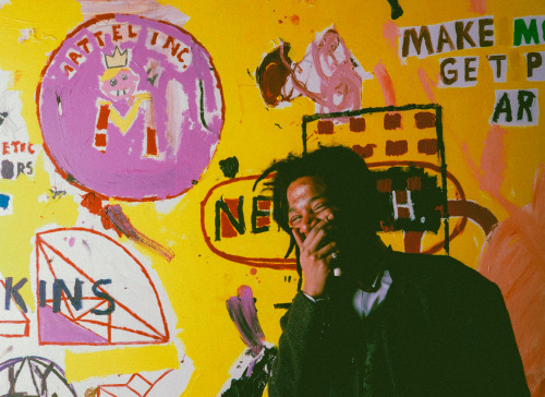 visawashere: strappedarchives:    Jean-Michel Basquiat in front of one of his painting