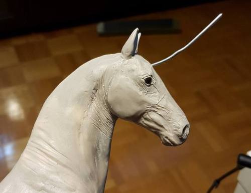 Some in progress unicorns. One is a new one, and the other is my slow destruction of an old sculptur