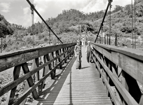 July 1940. Hazard, Kentucky. &ldquo;Miners&rsquo; children crossing swinging bridge from the