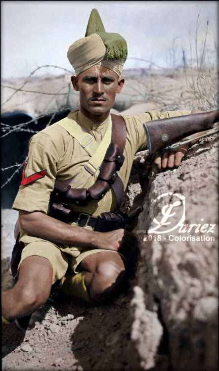 A Lance Naik (Lance Corporal) of the Indian 112th Infantry, 34th Brigade (17th Division), kneeling i