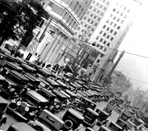 Traffic on busy Hollywood Boulevard, looking east towards Vine Street, 1932. The Pantages marquee is visible at center-right.