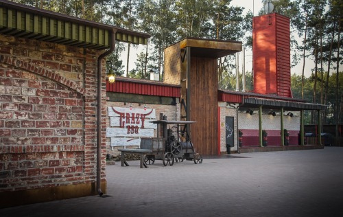 steampunktendencies:    At the CRAZY BBQ’s entrance visitors are greeted by an Austrian steam engine dated by 1900, which now serves as a barbecue.      Surrounded by a pine forest, the complex includes the main restaurant building, the Club House Crazy
