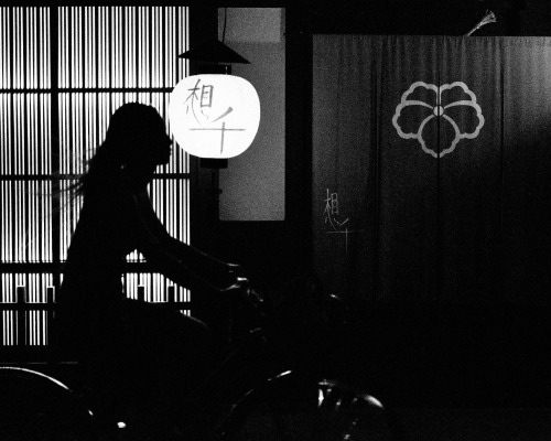 thekimonogallery:Woman on bicycle.  Japanese city street.  Photographer yuta35 of Flickr 