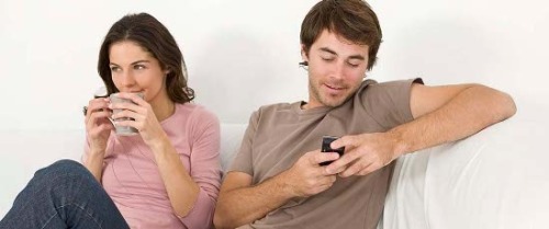 CAPTION COMPETITION TIME! It’s the first caption competition on this tumblr.  He’s reading a text and I love the look on her face.  She knows what he’s just about to read.   So please submit any caption you like - except cuckoldry