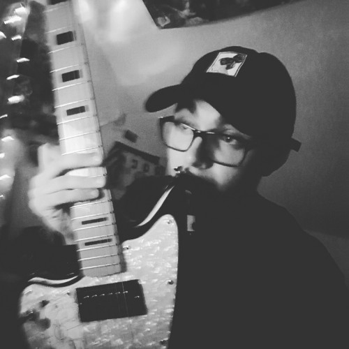 jesushadtwodads:  here’s my fucking face because i’m writing bad ass guitar parts to avoid being sad